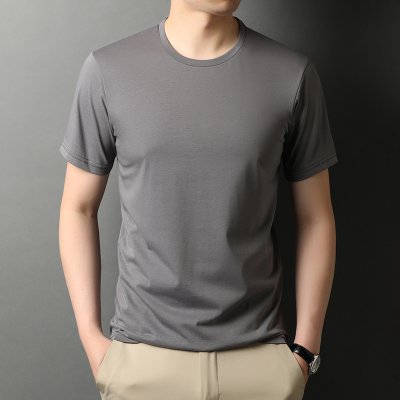 A man wearing a gray t - shirt